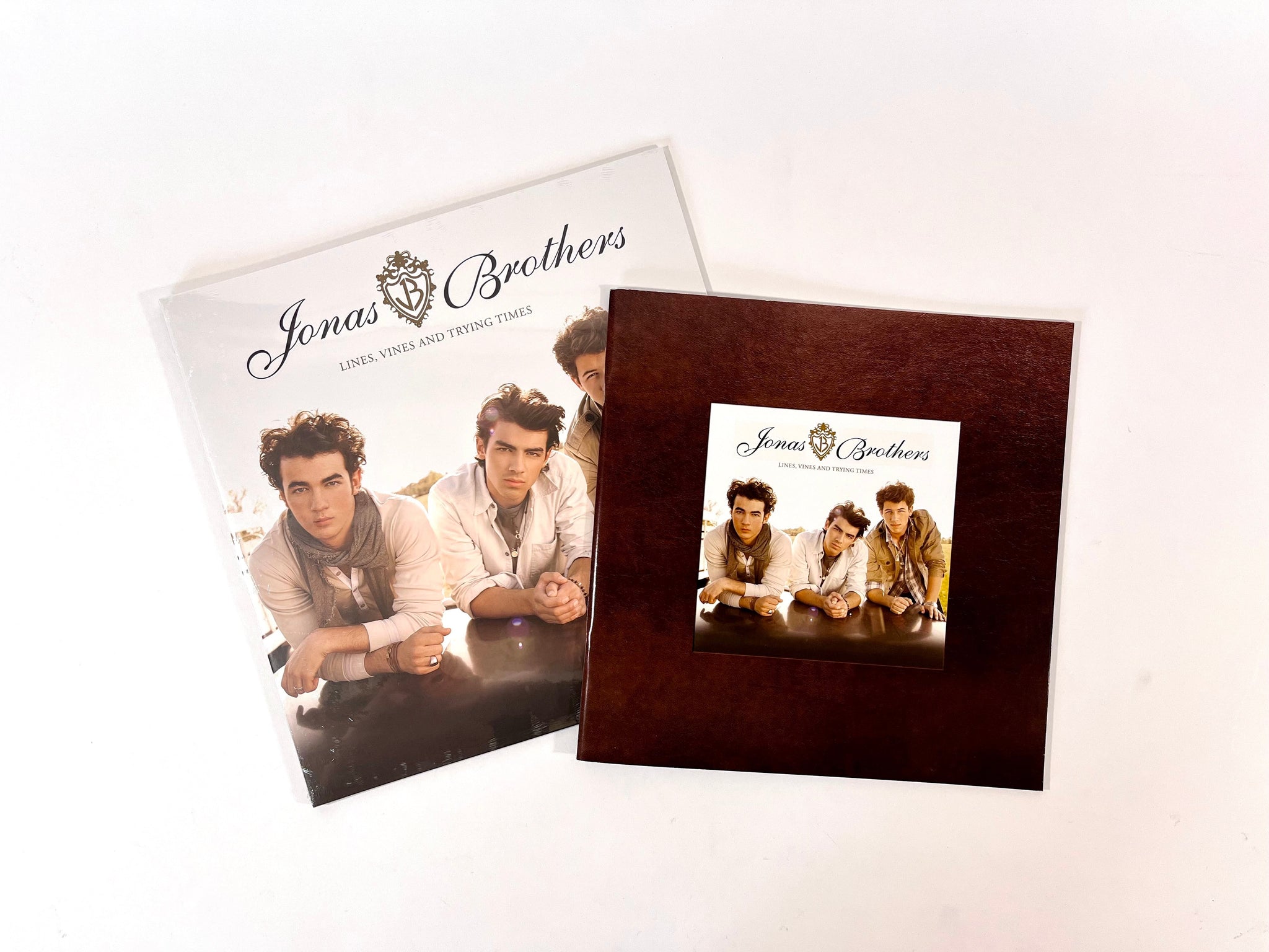 BUNDLE!  Jonas Brothers - "Lines, Vines & Trying Times" LP (in Coke Bottle Clear vinyl) + Photobook