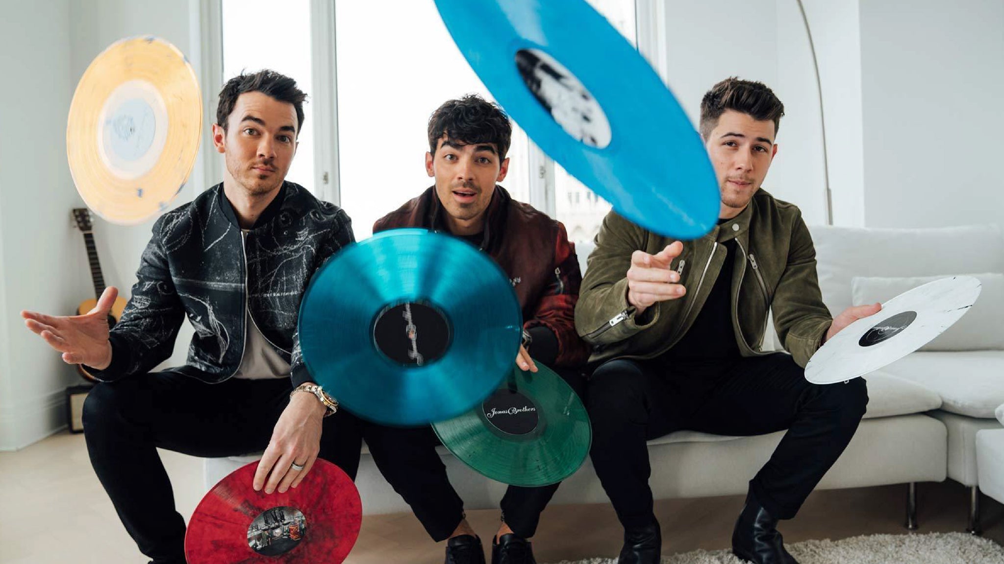 Jonas Vinyl Club Hero Image Jonas Brothers with vinyl records